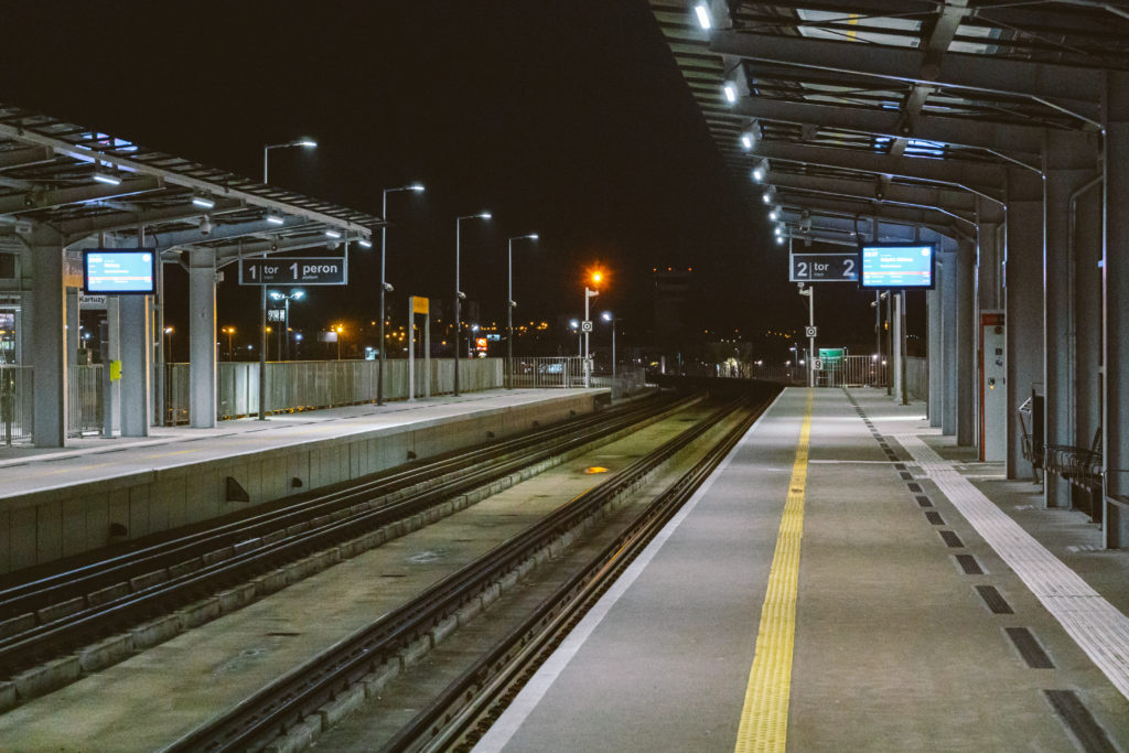 Train station at Gdansk airport GDN in Poland. railway platform of Lech Walesa Airport in Gdansk, Poland. Gdansk Airport lotnisko train station. Platform of Pomeranian Metropolitan Railway at night