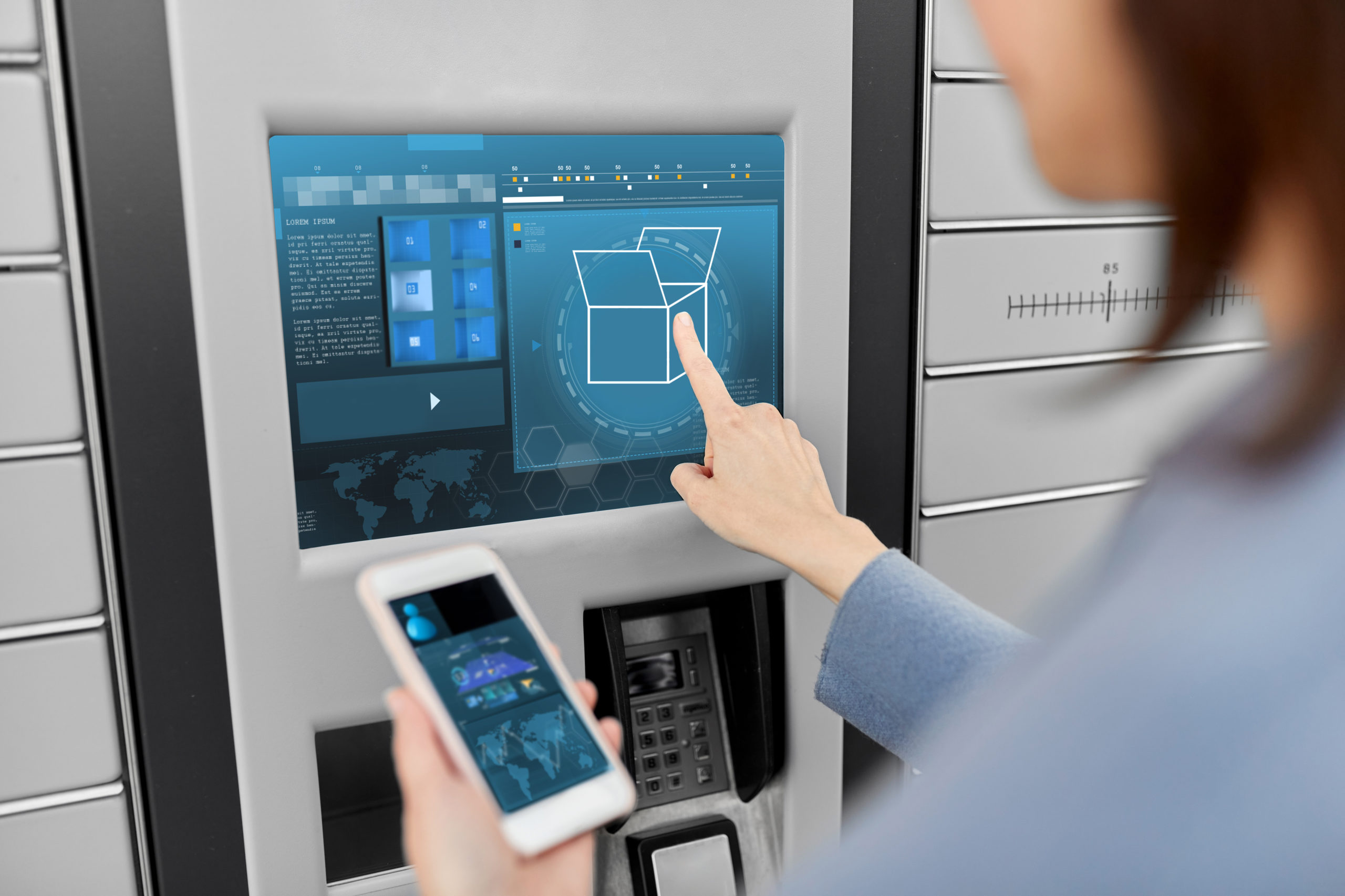 woman with smartphone at automated parcel machine